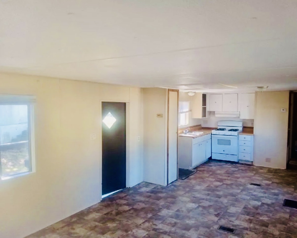 Bright open living and kitchen area inside a Stonewall rental home